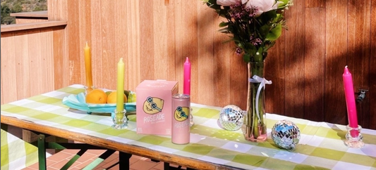 Roseade Cans displayed on table